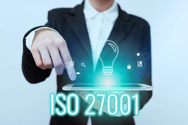 Text showing inspiration Iso 27001. Concept meaning specification for an information security management system Lady In Suit Pointing On Tablet Showing Futuristic Graphic Interface. — Stock Photo, Image