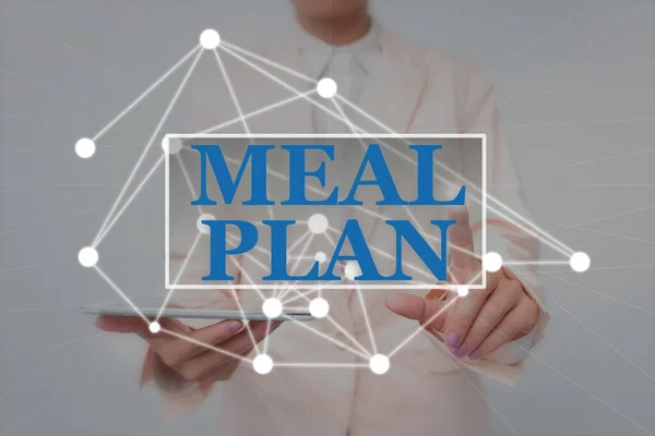 Hand writing sign Meal Plan. Word Written on arrangement scheme of what are going to eat next week month Lady Holding Tablet Pressing On Virtual Button Showing Futuristic Tech.