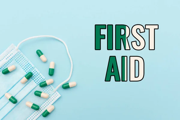 Text sign showing First Aid. Word for Practise of healing small cuts that no need for medical training Prescribed Medicine Vitamines And Minerals Pills And Medical Supplies — Stock Photo, Image