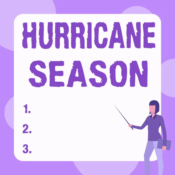 Podpis ukazujący sezon huraganów. Konceptualny czas zdjęć, gdy większość cyklonów tropikalnych oczekuje się rozwijać Lady Stojący Notatnik Holding wskazując kij w białej tablicy. — Zdjęcie stockowe