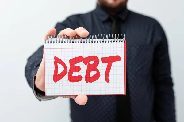 Handschriftliches Zeichen Schulden. Unternehmen nähern sich einer Geldsumme, die eine Person oder Organisation jemandem oder einer Bank schuldet. — Stockfoto
