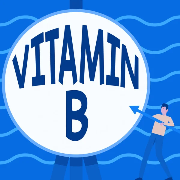 Konceptuell bildtext Vitamin B Konceptuell bild Näringsämne som hjälper till att hålla kroppen nerv och blodkroppar friska Man stående håller stora pilen pekar till Big Circular Target. — Stockfoto