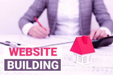 Web sitesi binasını sunan metin başlığı. İş konsepti araçları genellikle sayfalar A Young Lady or Business-Woman hesaplama ya da kredi imzalama Orexpences