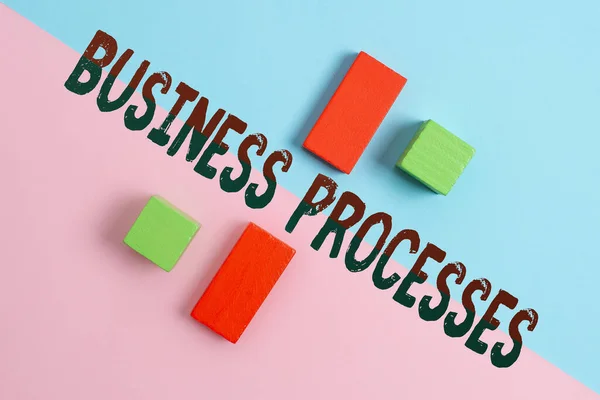 Writing displaying text Business Processes. Internet Concept Methods practices involves in running a commerce Two Objects Arranged Facing Inward Outward On a Separated Coloured Background — Stock Photo, Image