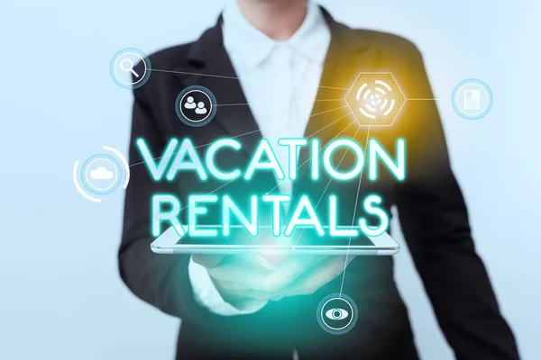 Text sign showing Vacation Rentals. Word Written on Renting out of apartment house condominium for a short stay Woman In Suit Standing Using Device Showing New Futuristic Virtual Tech. — Stock Photo, Image