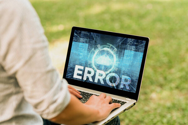 Writing displaying text Error. Internet Concept mistake Condition of being wrong in conduct judgement didnt mean it Woman Typing On Laptop Sitting Outside Back View Working From Home.