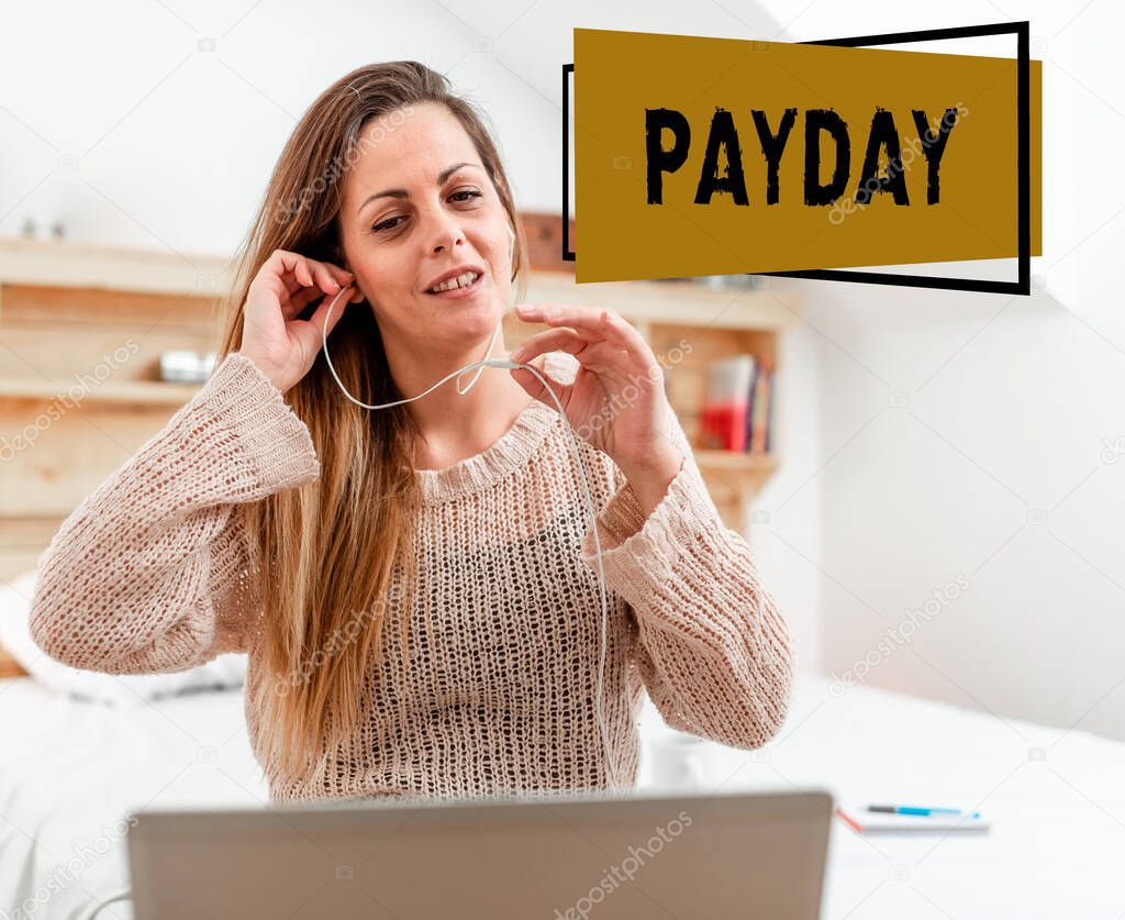 Sign displaying Payday. Business idea a day on which someone is paid or expects to be paid their wages Woman vediocalling through laptop from bedroom with wired headphones