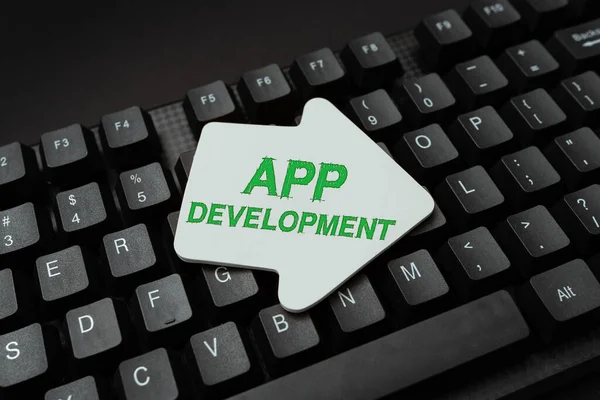 Υπογραφή εμφάνισης App Development. Επιχειρηματική ιδέα Υπηρεσίες ανάπτυξης για φοβερό κινητό και web εμπειρίες Μπαίνοντας σε νέους κωδικούς προγραμματισμού, πληκτρολογώντας Συναισθηματικές διηγήσεις — Φωτογραφία Αρχείου