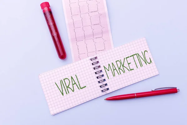 Inspiration showing sign Viral Marketing. Business concept whereby consumer encouraged share information via Internet Reading Graph And Writing Important Medical Notes Test Result Analysis