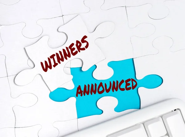 Conceptual display Winners Announced. Business showcase Announcing who won the contest or any competition Building An Unfinished White Jigsaw Pattern Puzzle With Missing Last Piece — Stock Photo, Image