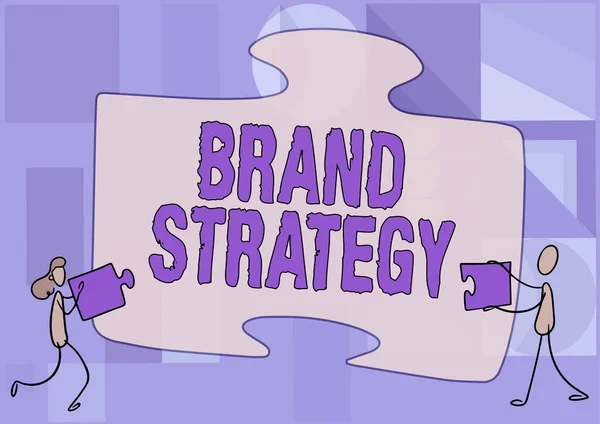 Tekst met inspiratie Brand Strategy. Word Written on Lange termijn marketing ondersteuning voor een product Marketing Collega 's Tekenen passen twee stukjes puzzel samen Teamwork. — Stockfoto