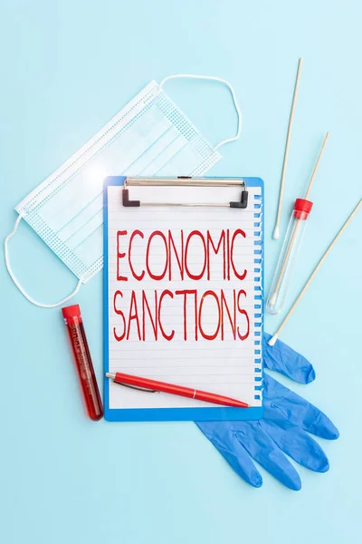 Handwriting text Economic Sanctions. Business overview Penalty Punishment levied on another country Trade war Writing Important Medical Notes Laboratory Testing Of New Virus Medicine — Stock Photo, Image