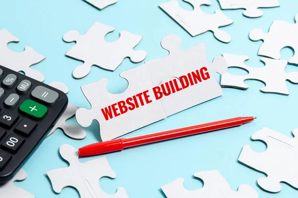 Handwriting text Website Building. Business concept tools that typically allow the construction of pages Building An Unfinished White Jigsaw Pattern Puzzle With Missing Last Piece — Stock Photo, Image