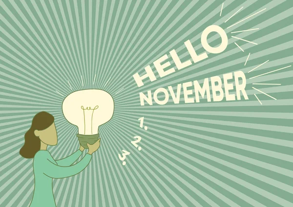 Написання тексту Hello November. Перегляд ділових відносин використовується при вітанні одинадцятого місяця року Леді Стендінг Холдинг, щоб показати нові ідеї. — стокове фото