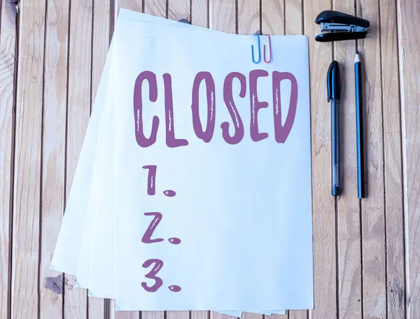 Sign displaying Closed. Word Written on Finished and therefore not able to be discussed any more Not open Office Stationery Paper Clipped Together Laying Flat On Table. — Stock Photo, Image