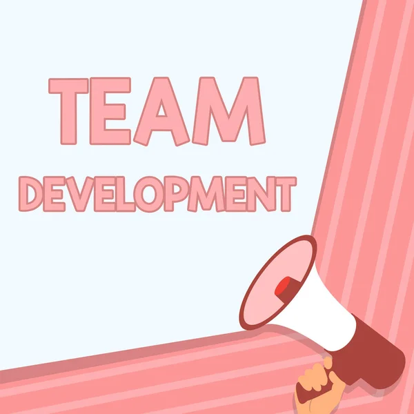 Conceptual caption Team Development. Internet Concept learn why and how small groups change over time with graphs Illustration Of Hand Holding Megaphone Making Wonderfull Announcement. — Stock Photo, Image