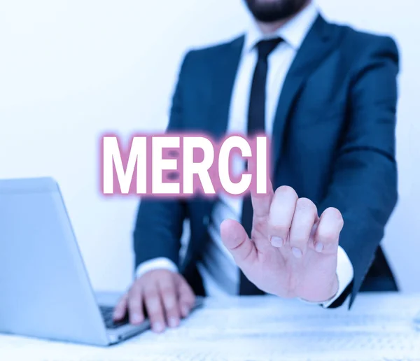 Handwriting text Merci. Business idea what is said or response when someone helps you in France Thank you Remote Office Work Online Presenting Communication Technology — 图库照片