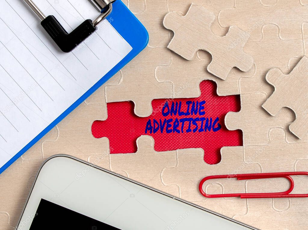 Sign displaying Online Advertising. Word for Internet Web Marketing to Promote Products and Services Building An Unfinished White Jigsaw Pattern Puzzle With Missing Last Piece