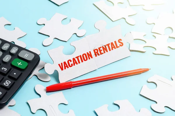 Text caption presenting Vacation Rentals. Business approach Renting out of apartment house condominium for a short stay Building An Unfinished White Jigsaw Pattern Puzzle With Missing Last Piece — Stock Photo, Image
