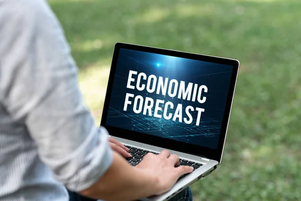 Writing displaying text Economic Forecast. Word for Process of making predictions about the economy condition Woman Typing On Laptop Sitting Outside Back View Working From Home. — Stock Photo, Image
