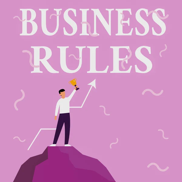 Hand writing sign Business Rules. Business showcase the principles which determine the corporation s is activities Businessman Drawing Standing On Big Rock Proudly Holding Trophy.