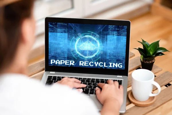 Text showing inspiration Paper Recycling. Concept meaning Using the waste papers in a new way by recycling them Woman Typing On Laptop Beside Coffe Mug And Plant Working From Home. — 图库照片