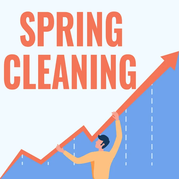 テキストを表示する春のクリーニングを書く。春に徹底的に家を掃除する練習のための言葉男はビジネスの成長を示すグラフ保持矢印を描きます. — ストック写真