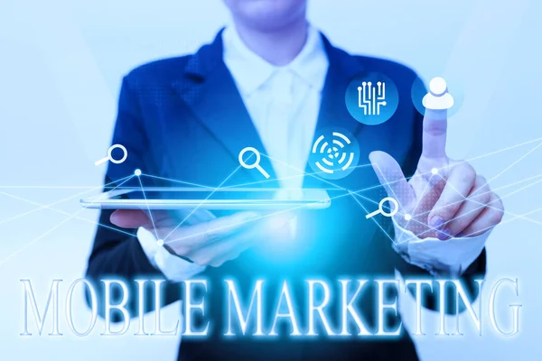Text caption presenting Mobile Marketing. Business concept technique focused reaching audience on their smart device Woman In Suit Holding Tablet Pointing Finger On Futuristic Virtual Button. — 图库照片