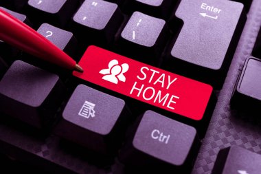 El yazısı işareti. Evde kal. İş yaklaşımı bir etkinlik için dışarı çıkmamalı ve evde veya evde kalıp Resim Açıklamaları ve Anahtar sözcükler yazmalı, Yeni İnternet Sitesine girilmeli