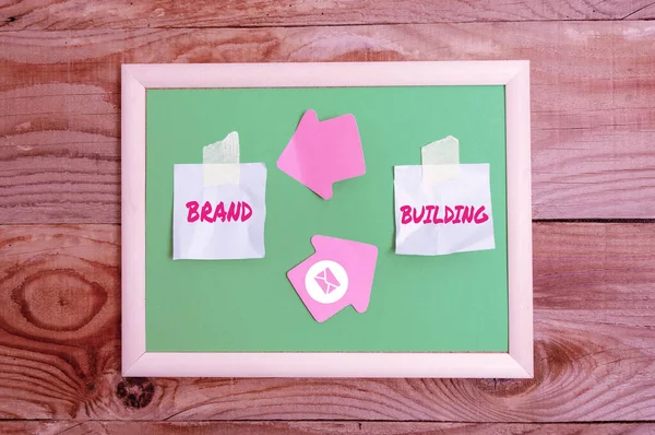 Text showing inspiration Brand Building. Business showcase Generating awareness Establishing and promoting company Display of Different Color Sticker Notes Arranged On flatlay Lay Background — Fotografia de Stock