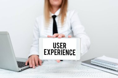 Kullanıcı Deneyimi işaretini gösteren bir ilham. Konsept fotoğraf kullanımı özellikle stajyerin yeni bir işe başlamasının ne kadar memnun edici olduğu, öğrenci sunum raporları