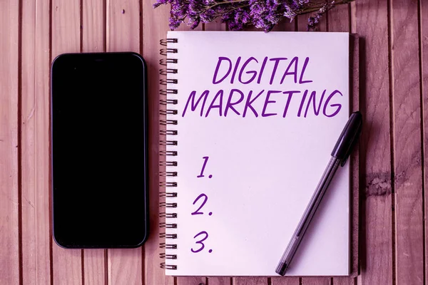 Sign displaying Digital Marketing. Word for Search Engine Optimazation Pay Per Click Ad Internet Empty Open Journal Beside Mobile With Pens On Top Of Wooden Desk. — Foto Stock