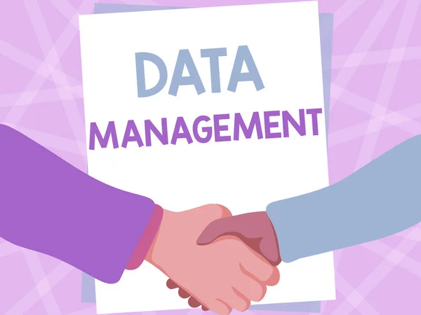 Sign displaying Data Management. Business approach The practice of organizing and maintaining data processes Two Men Drawing With Empty Paper Shake Hands Presenting Agreement. — 图库照片