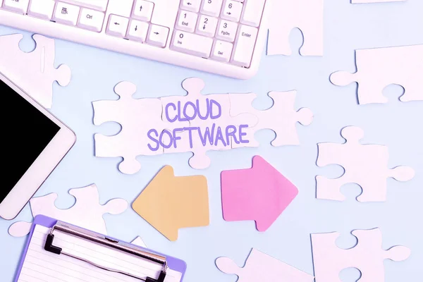 Text showing inspiration Cloud Software. Business approach Programs used in Storing Accessing data over the internet Building An Unfinished White Jigsaw Pattern Puzzle With Missing Last Piece — Foto Stock