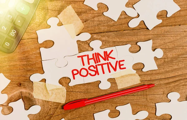 Text caption presenting Think Positive. Business concept The tendency to be positive or optimistic in attitude Building An Unfinished White Jigsaw Pattern Puzzle With Missing Last Piece — Fotografia de Stock