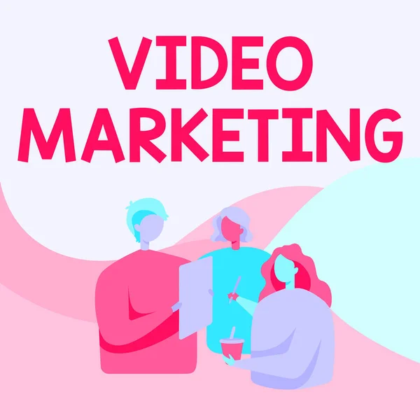 Writing displaying text Video Marketing. Business showcase create short videos about specific topics using articles Colleagues Standing Talking To Each Other Holding Paper Pen Cup. — Foto Stock