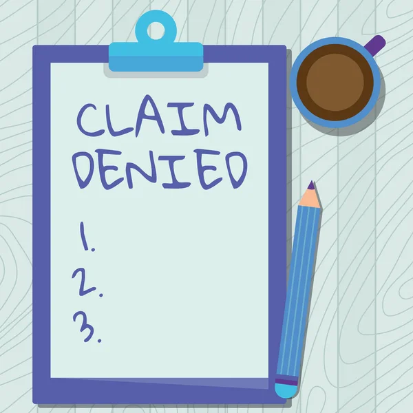 Text caption presenting Claim Denied. Concept meaning Requested reimbursement payment for bill has been refused Illustration Of Pencil On Top Of Table Beside The Clipboard And Coffee Mug. — Foto Stock