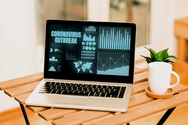 Text showing inspiration Coronavirus Outbreak. Conceptual photo infectious disease caused by newly discovered COVID19 Laptop Resting On A Table Beside Coffee Mug And Plant Showing Work Process. — Stockfoto