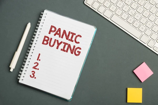 Text sign showing Panic Buying. Word for buying large quantities due to sudden fear of coming shortage Keyboard Over A Table Beside A Notebook And Pens With Sticky Notes — Fotografia de Stock