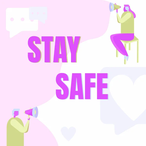 Sign displaying Stay Safe. Word for secure from threat of danger, harm or place to keep articles Man Standing And Woman Sitting Both Holding Megaphone With Message Symbol. — 图库照片