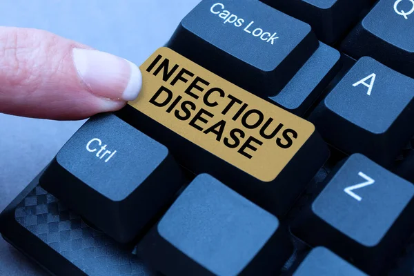 Text sign showing Infectious Disease. Concept meaning caused by pathogenic microorganism, such as viruses, and more Typing Device Instruction Manual, Posting Product Review Online — Stockfoto