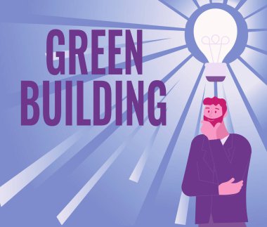 Metin Yeşil Bina gösterimi yazılıyor. İşletme fikri. Çevreye duyarlı bir yapı. Yeni Harika Fikirlerle Gelen Bir Adamın Sürdürülebilir İmajı..