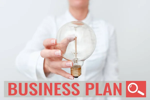 Inspiration showing sign Business Plan. Business idea Structural Strategy Goals and Objectives Financial Projections Lady in business outfit holding lamp presenting new technology ideas — Foto Stock
