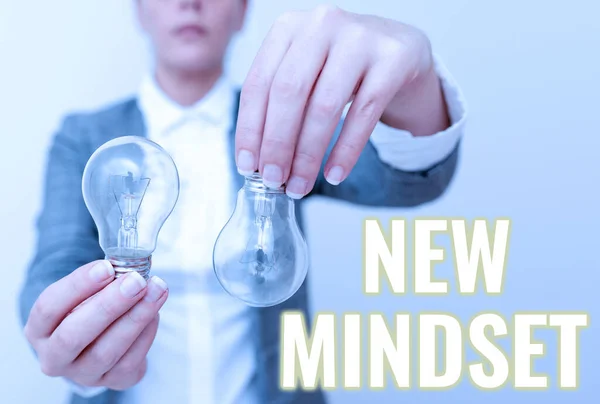 Conceptual caption New Mindset. Business approach freshly madeup thoughts and beliefs shaping a person s is mind Lady outfit holding two lamps upside down presenting new technology ideas — Fotografia de Stock