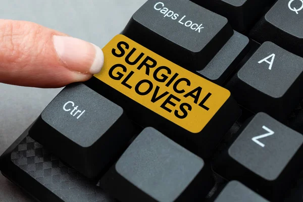 Text sign showing Surgical Gloves. Business concept to protect from the exposure to infectious materials Typing Device Instruction Manual, Posting Product Review Online — Fotografia de Stock