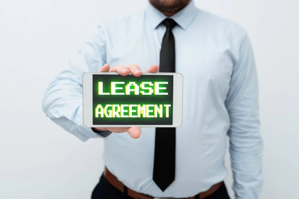 Hand writing sign Lease Agreement. Business approach Contract on the terms to one party agrees rent property Presenting New Technology Ideas Discussing Technological Improvement — стоковое фото