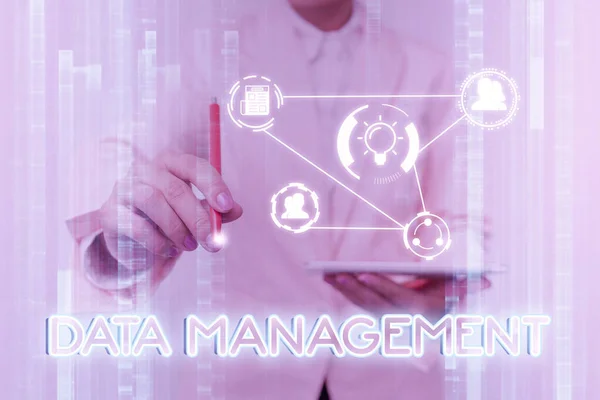 Inspiration showing sign Data Management. Business overview The practice of organizing and maintaining data processes Lady In Uniform Touching And Using Futuristic Holographic Technology. — Stockfoto
