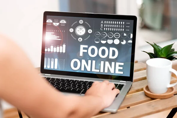 Text showing inspiration Food Online. Conceptual photo variety of food set up in a website directly delivered by store Hand Typing On Laptop Beside Coffe Mug And Plant Working From Home. — 图库照片