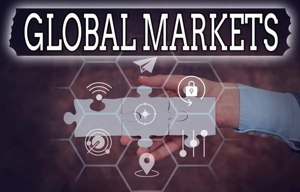 Inspiration showing sign Global Markets. Business overview Trading goods and services in all the countries of the world Hand Holding Jigsaw Puzzle Piece Unlocking New Futuristic Technologies. — Stockfoto