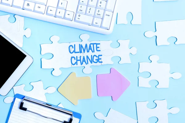 Text sign showing Climate Change. Internet Concept Increase in global average temperature Weather transformation Building An Unfinished White Jigsaw Pattern Puzzle With Missing Last Piece — Foto Stock